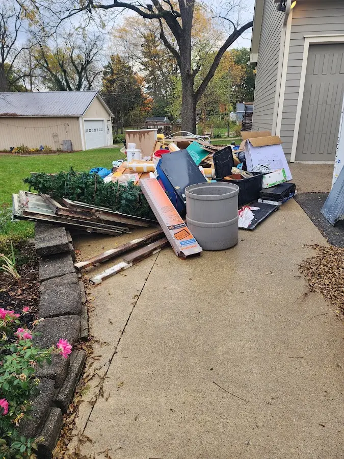 Dumpster being loaded with debris for Residential Dumpster Rental in Cannon AFB